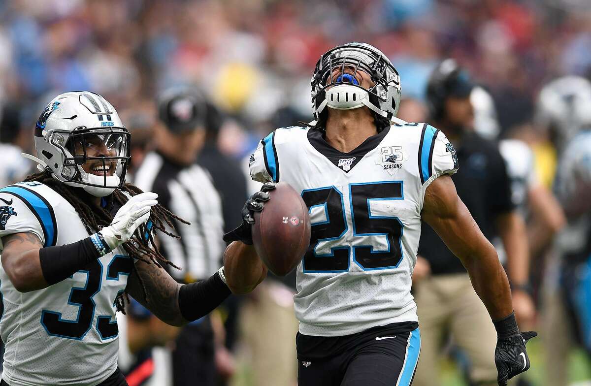 Carolina Panthers safety Eric Reid (25) celebrates with defensive back Tre Boston (33) after recovering a fumble by Houston Texans quarterback Deshaun Watson in the fourth quarter at NRG Stadium in Houston on Sunday, Sept. 29, 2019. The Panthers won, 16-10. (David T. Foster III/Charlotte Observer/TNS)