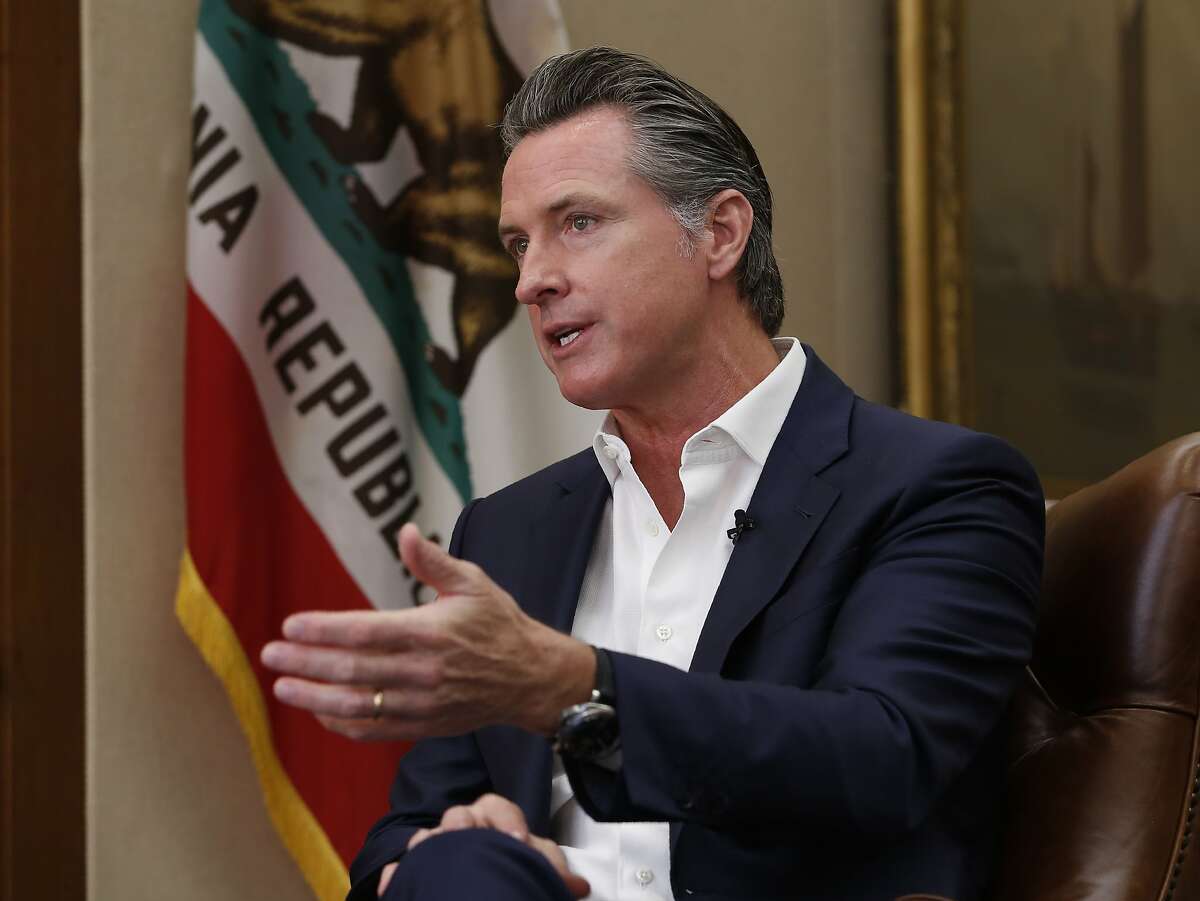 FILE - In this Oct. 8, 2019, file photo, California Gov. Gavin Newsom gestures during an interview in Sacramento, Calif. The Democrats who rule California took on homegrown tech giants Uber and Lyft over their work force, convinced some of the world's biggest automakers to buck the president on fuel emissions and passed a law that could change college sports. On issues big and small, hotels soon will be forbidden from providing guests with little plastic shampoo bottles, California this year has marched farther left and tried to pull the rest of the country with it. (AP Photo/Rich Pedroncelli, File)
