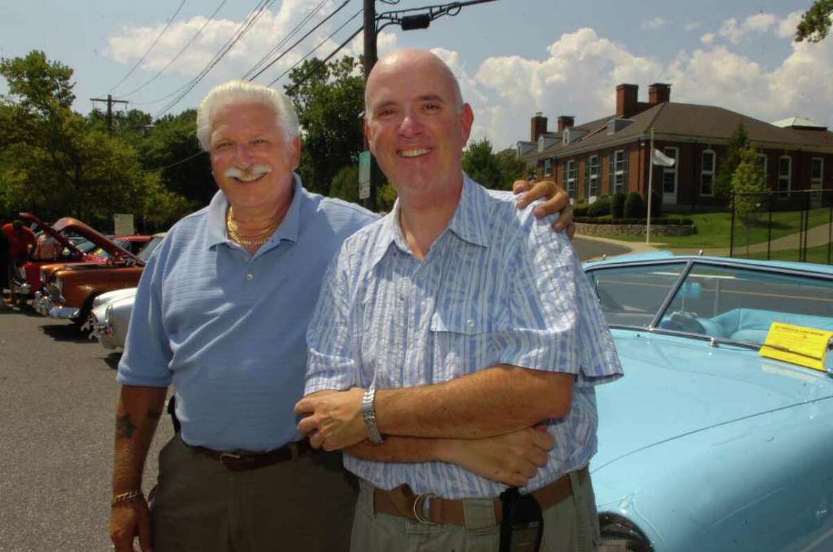 Carmen Moretti, left, the chairman of the car show, with his 1951 Ford, and Rev. Matthew Mauriello, pastor of St. Roch Church, at the church's first car show on Sunday, Aug. 8, 2010.