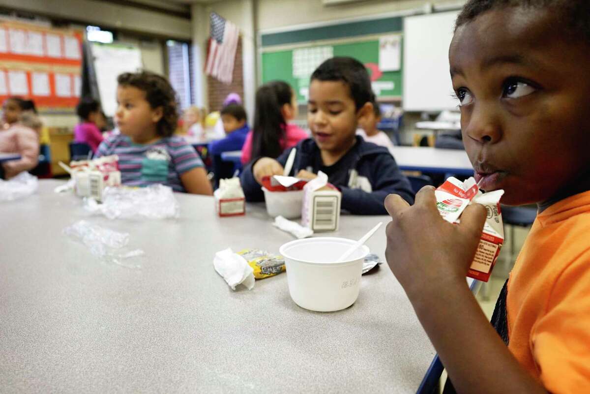 Dr. Martin Luther King Jr. Elementary School students in Scott Heller's kindergarten class eat breakfast on Tuesday, Oct. 22, 2019, in Schenectady, N.Y. All the students at the school get free breakfast in the classroom and free lunch. (Paul Buckowski/Times Union)