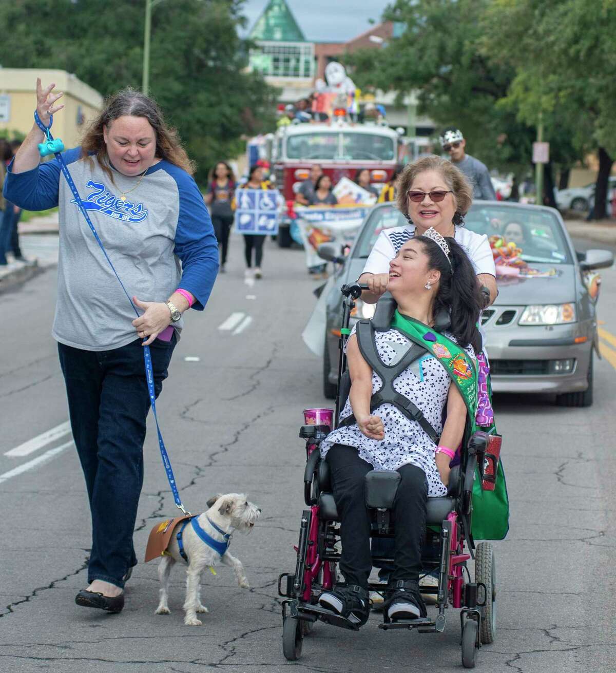 The 2018 Fiesta Especial Queen Vanesa Serana, 21, and Gypsy the dog participate in the inaugural abilitySTRONG Parade in October 2018. This year’s parade and festival starts Saturday at 9 a.m. with the parade and march, followed by the festival at Market Square downtown.