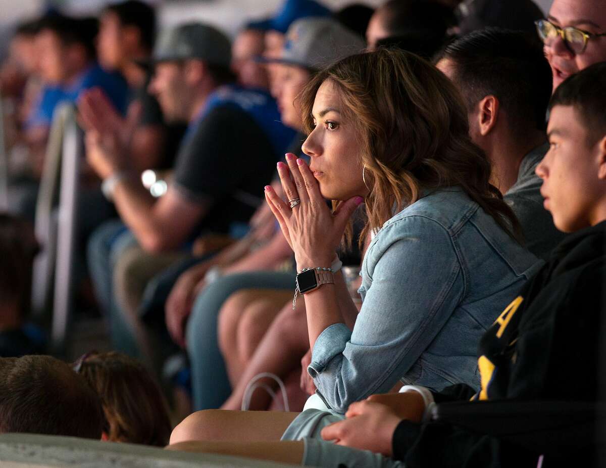 Golden State Warriors fans watch their team fall behind to the Los Angeles Clippers in their season-opening NBA basketball game at the new Chase Center on Thursday, Oct. 24, 2019 in San Francisco, Calif.