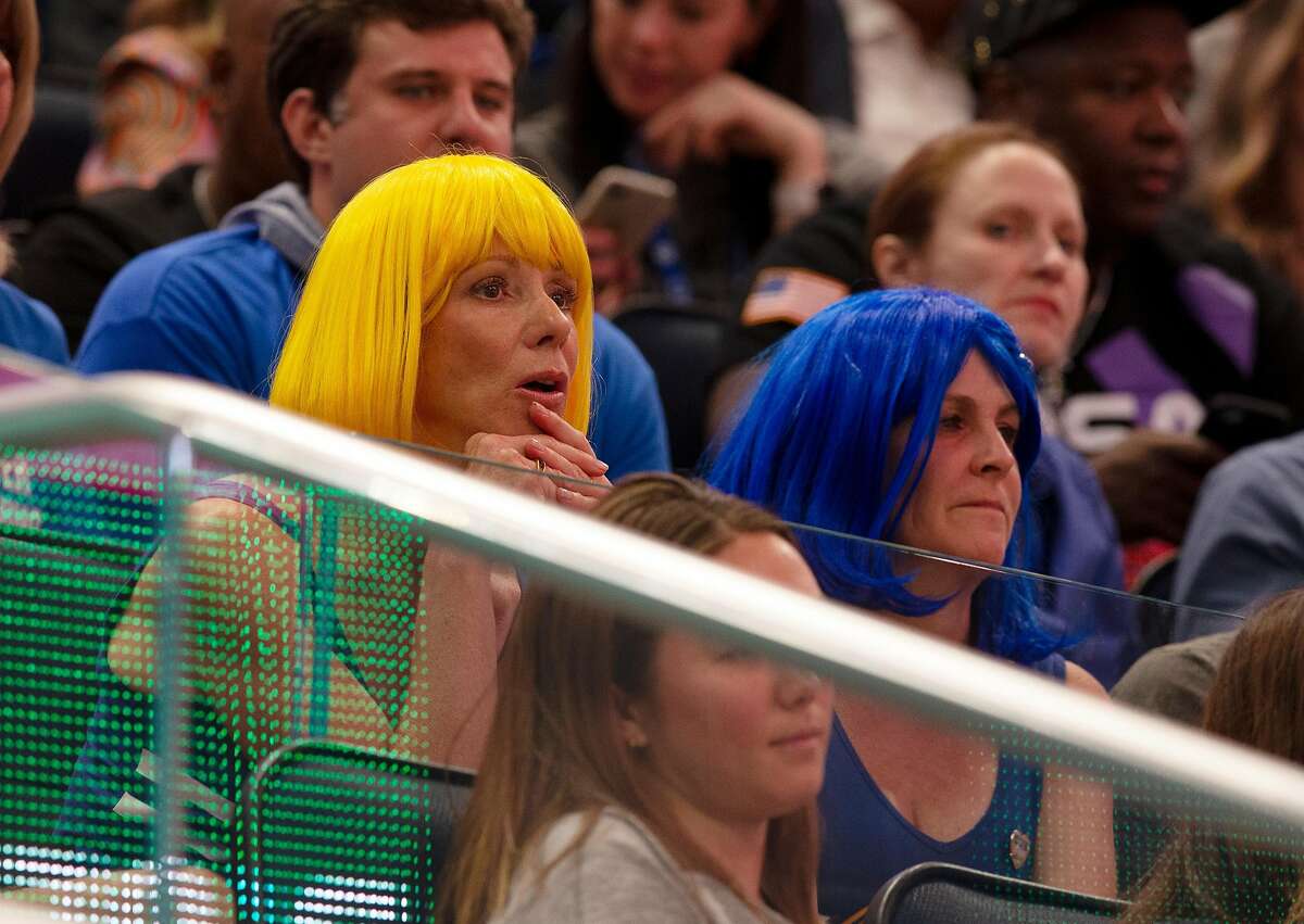 Unidentified Golden State Warriors fans watch their team take on the the Los Angeles Clippers in their season-opening NBA basketball game at the new Chase Center on Thursday, Oct. 24, 2019 in San Francisco, Calif.