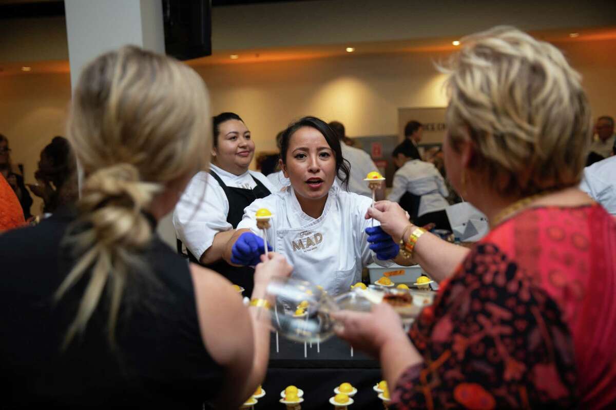 Karla Espinosa of MAD restaurant serves guests at the Houston Chronicle 2019 Culinary Stars event.