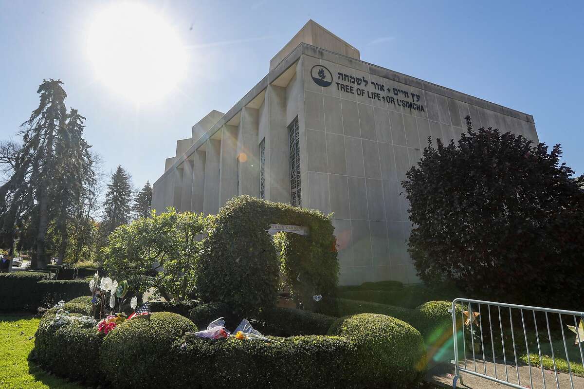 The sun shines over gardens surrounding the Tree of Life Synagogue Thursday, Oct. 24, 2019 in the Squirrel Hill neighborhood of Pittsburgh. Sunday, Oct. 27, marks the one-year anniversary of the deadliest attack on Jews in U.S. history. A virtual remembrance, an overseas concert and community service projects highlight the many plans for commemorating the loss. (AP Photo/Keith Srakocic)