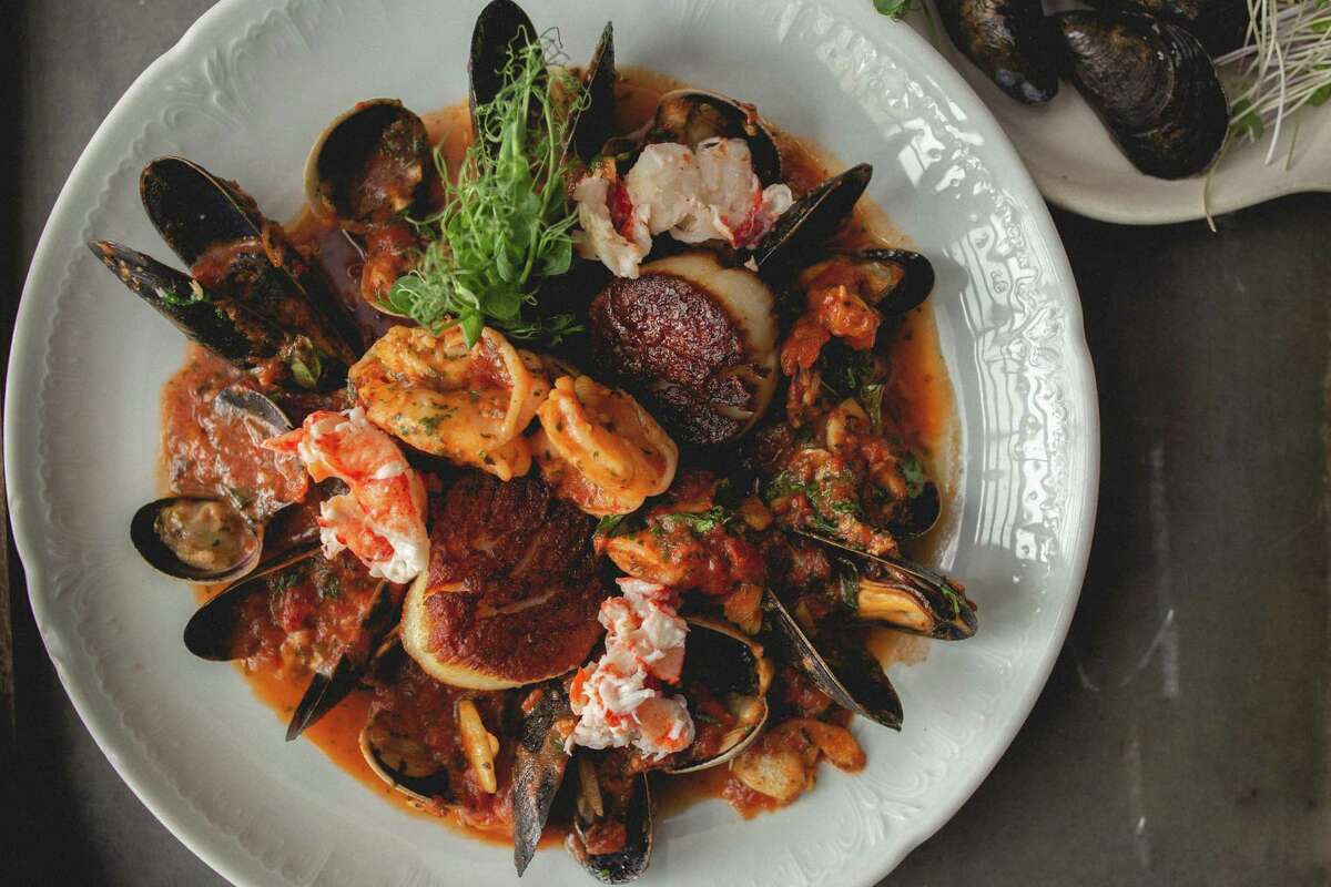 Bartolo’s Tuscan stew is served in a large bowl full of jumbo prawns, scallops, lobster, Manila clams, mussels, in a gorgeous tomato basil broth with toasted focaccia to dip.