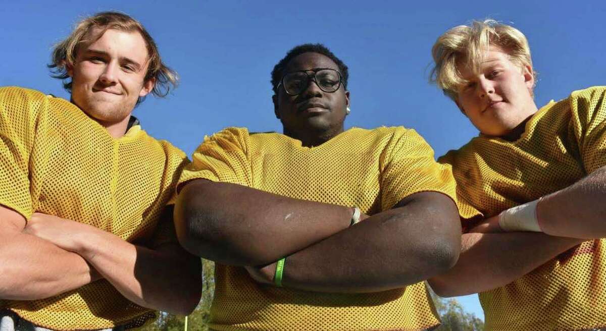 St. Joseph football's defensive line of Mike Morrissey, Jermaine Williams and Cayden Porter are anchoring the Hogs defense that has allowed just 9.6 points per game this season.
