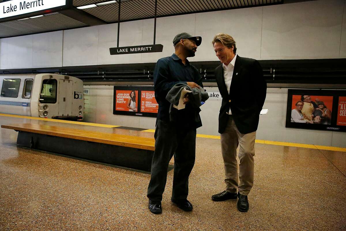BART General Manager Robert Powers (right) talks with BART train operator Al Davillier (left) on the platform after Powers disembarked at Lake Merritt BART station on Monday, September 30, 2019 in Oakland, CA.