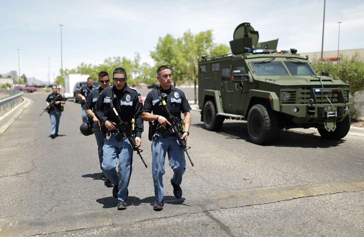 Local law enforcement respond to an active shooter situation near Cielo Vista Mall in El Paso, Texas. Despite the recent surge in gun violence committed by police, a reader says law enforcement should remain armed.