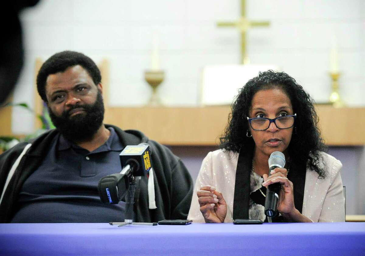 Steven Barrier Sr. sits next to Valerie Jaddo, mother of Steven Barrier, as she reads a prepared statement during a press conference at Bethel AME Church in Stamford on Oct. 25, 2019, regarding the incident with her son and the Stamford Police Department. Clergy, community leaders and the Stamford NAACP along with family members release of information into what happen.