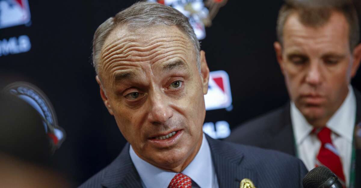 MLB Commissioner Rob Manfred answers questions before Game 3 of the baseball World Series between the Houston Astros and the Washington Nationals Friday, Oct. 25, 2019, in Washington. (AP Photo/Patrick Semansky)