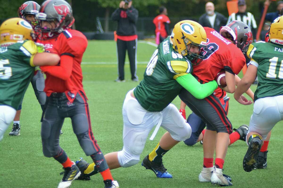 Junior Crusher Richie McMurray (88) makes a tackle.
