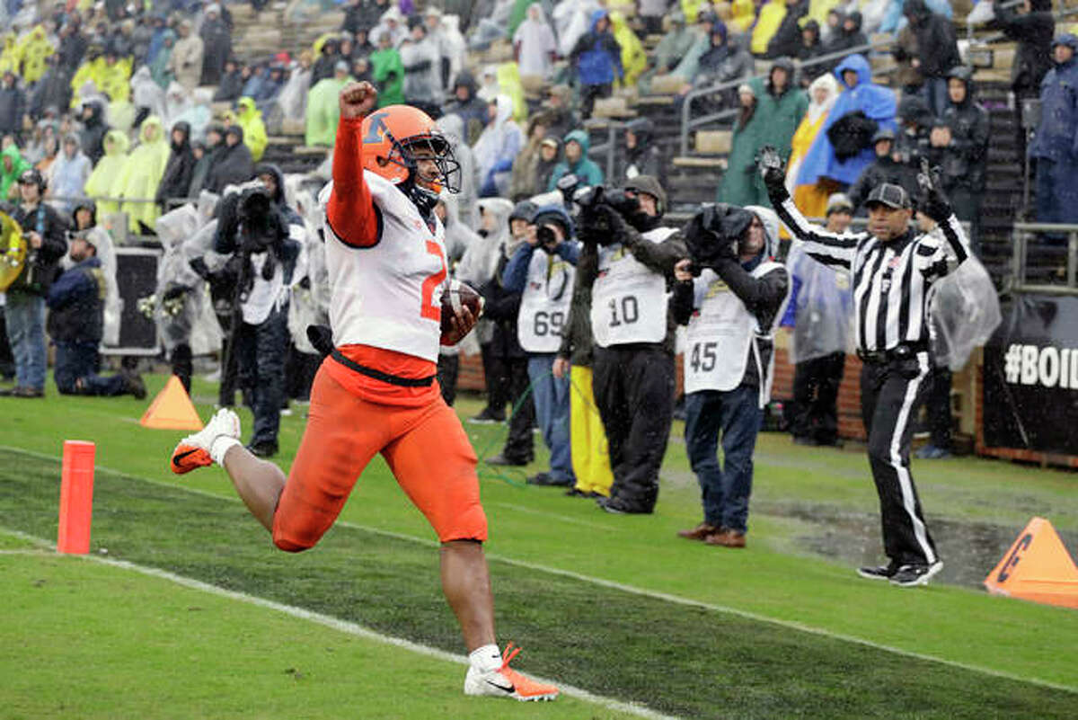Illinois running back Reggie Corbin (2) reacts after running for a touchdown Saturday tagainst Purdue in West Lafayette, Ind.