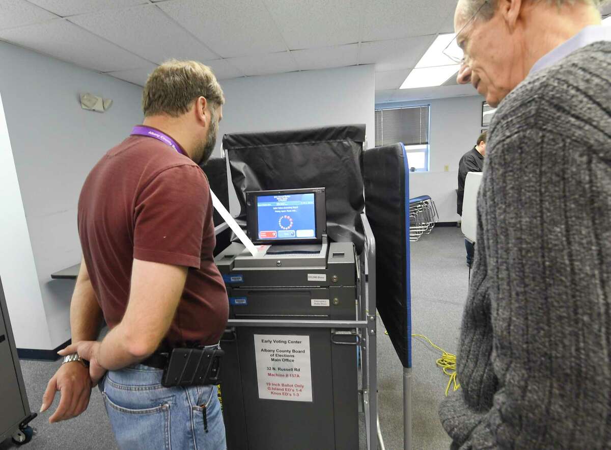 Election officals ready a voting machine for registered New York voters take advantage of a new early voting election law to cast their vote before the Tuesday November 5th. general election at the Albany County Board of Elections Saturday, Oct. 26, 2019, in Albany, N.Y. (Hans Pennink / Special to the Times Union)