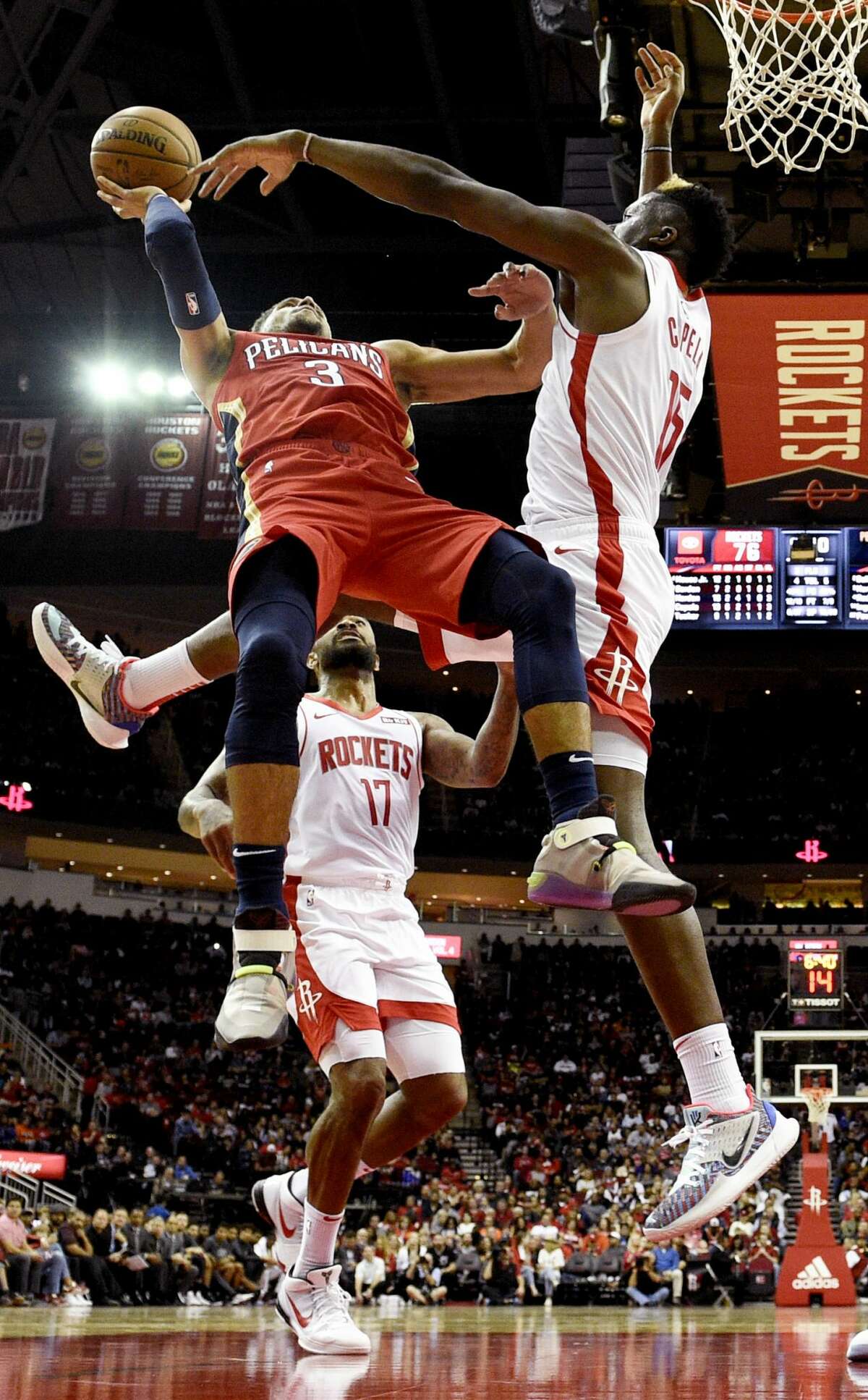 New Orleans Pelicans guard Josh Hart (3) shoots as Houston Rockets center Clint Capela, right, defends during the second half of an NBA basketball game, Saturday, Oct. 26, 2019, in Houston. (AP Photo/Eric Christian Smith)