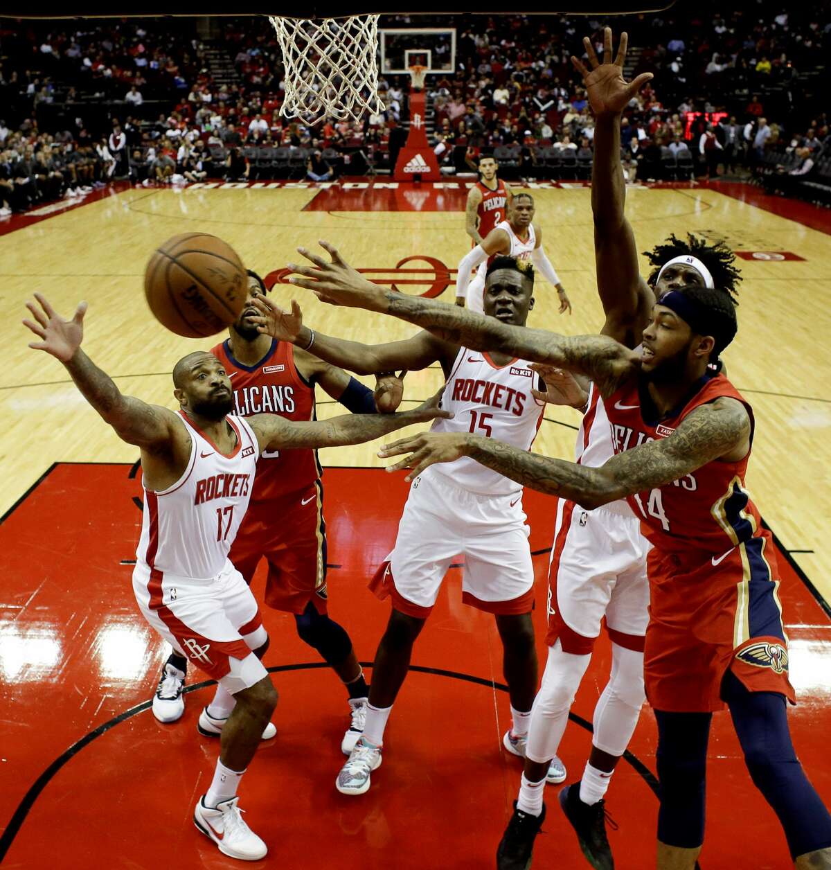 New Orleans Pelicans forward Brandon Ingram, right, passes the ball during the second half of an NBA basketball game against the Houston Rockets, Saturday, Oct. 26, 2019, in Houston. (AP Photo/Eric Christian Smith)