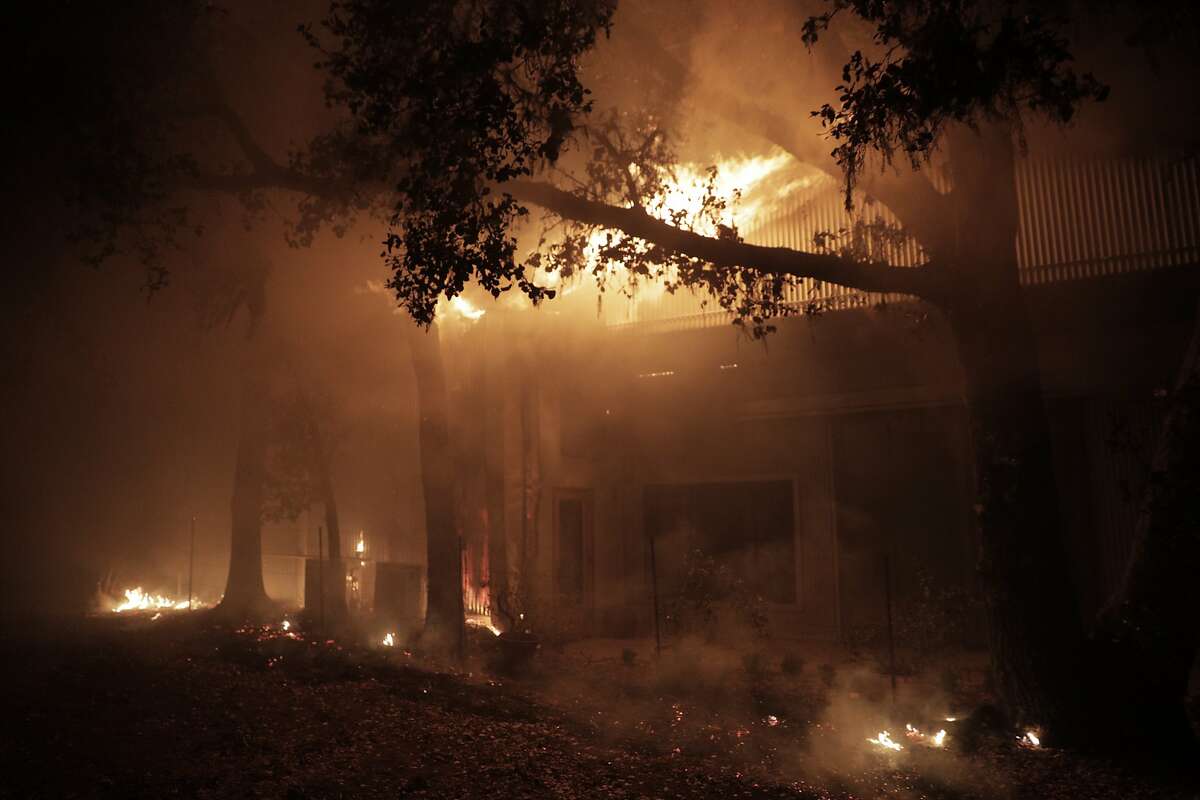 A structure burns west of Highway 128 on Soda Rock Ln as the Kincade Fire continues to burn in Healdsburg, Calif., on Sunday, October 27, 2019.