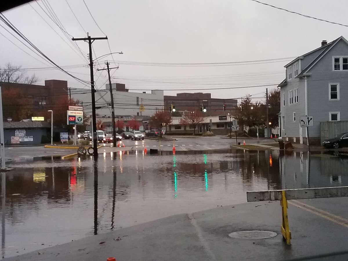 Rain floods a West Haven street.