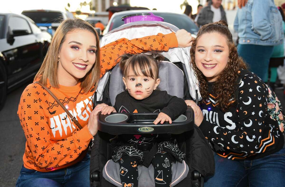 Families don their Halloween costumes as they collect treats on Saturday, Oct. 26, 2019, at the Outlet Shoppes at Laredo during it's 3rd Annual Trunk or Treat event.