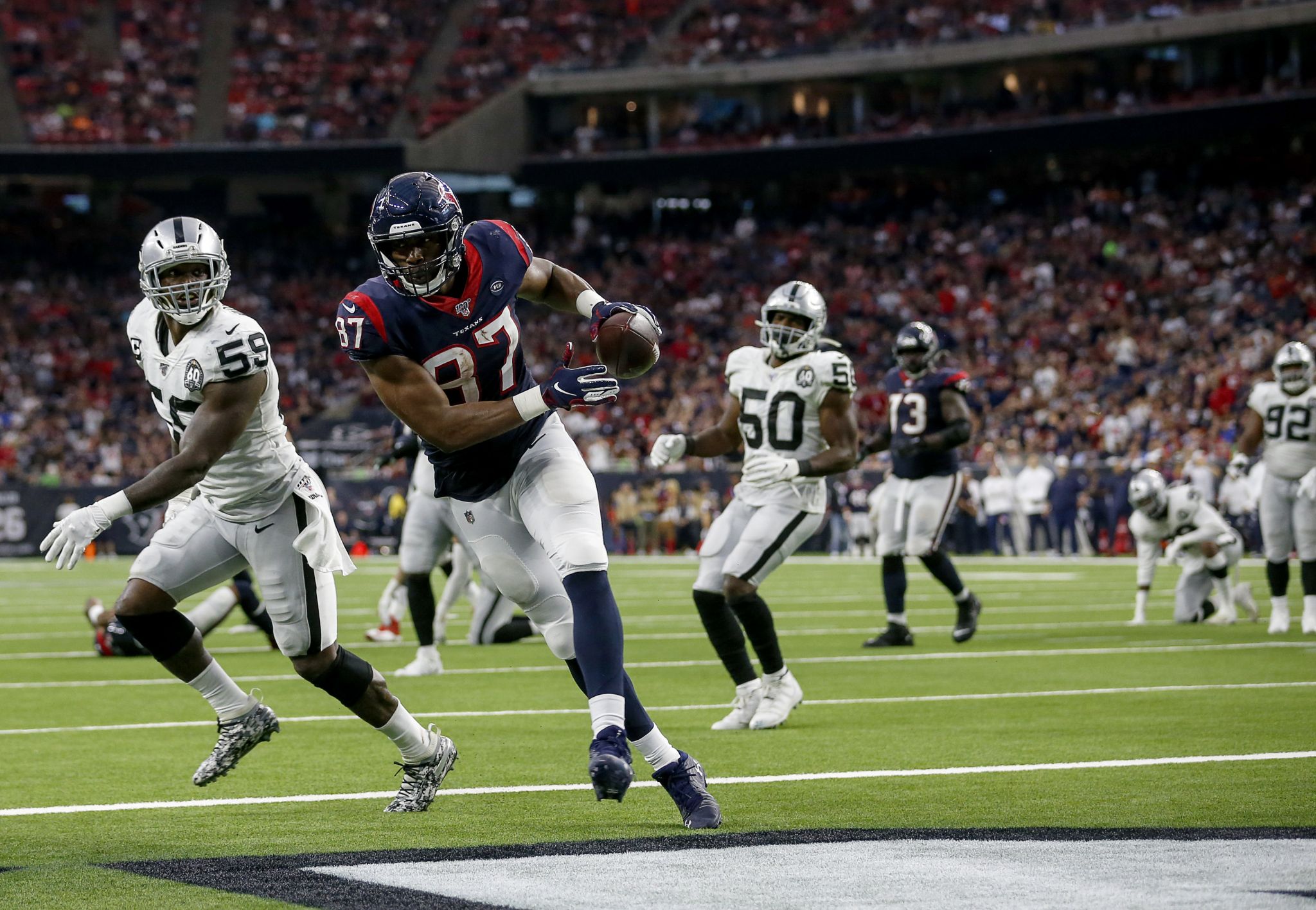 October 27, 2019 : Houston Texans tight end Darren Fells (87) catches a  pass during the game against the Oakland Raiders at NRG Stadium in Houston,  Texas. The score at the half