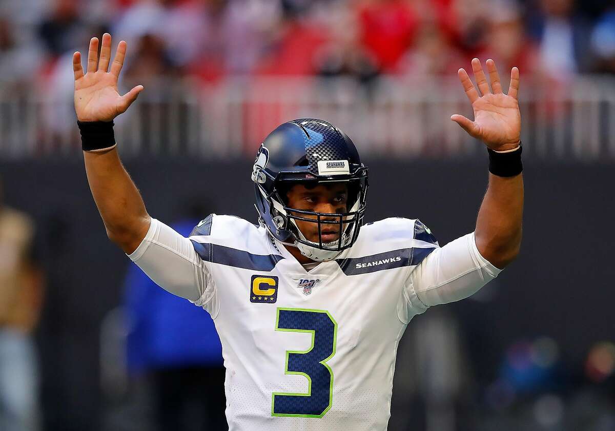 Russell Wilson of Seattle Seahawks throws 3 TD passes en route to