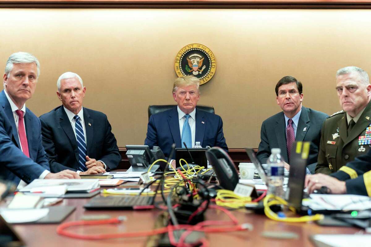 In this image released by the White House, President Donald Trump is joined by Vice President Mike Pence, second from left, national security adviser Robert OaBrien, left; Secretary of Defense Mark Esper, second from right, and Chairman of the Joint Chiefs of Staff Army Gen. Mark A. Milley, right, Saturday, Oct. 26, 2019, in the Situation Room of the White House monitoring developments in the U.S. Special Operations forces raid that took out Islamic State leader Abu Bakr al-Baghdadi.. (Shealah Craighead/White House via AP)