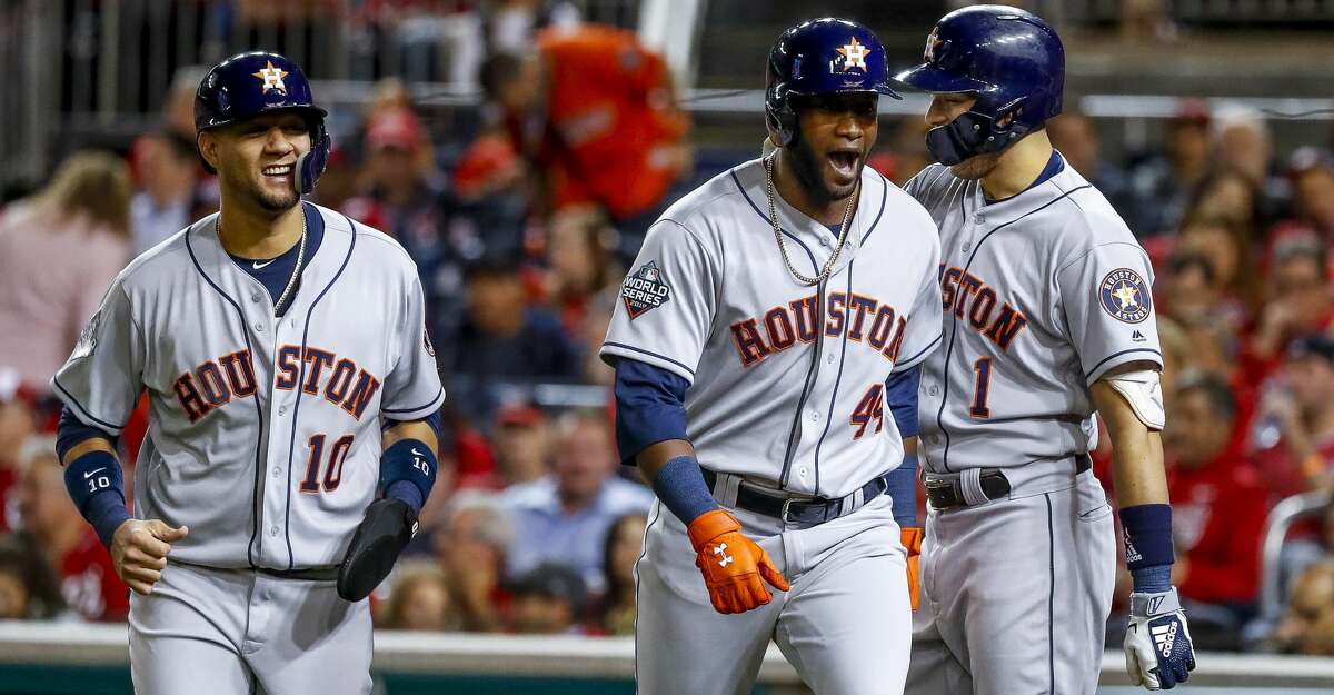Houston Astros left fielder Yordan Alvarez (44) is welcomed home by Houston Astros shortstop Carlos Correa (1) and Houston Astros first baseman Yuli Gurriel (10) after Alvarez hit a two-run home run during the second inning of Game 5 of the World Series at Nationals Park in Washington, D.C. on Sunday, Oct. 27, 2019.
