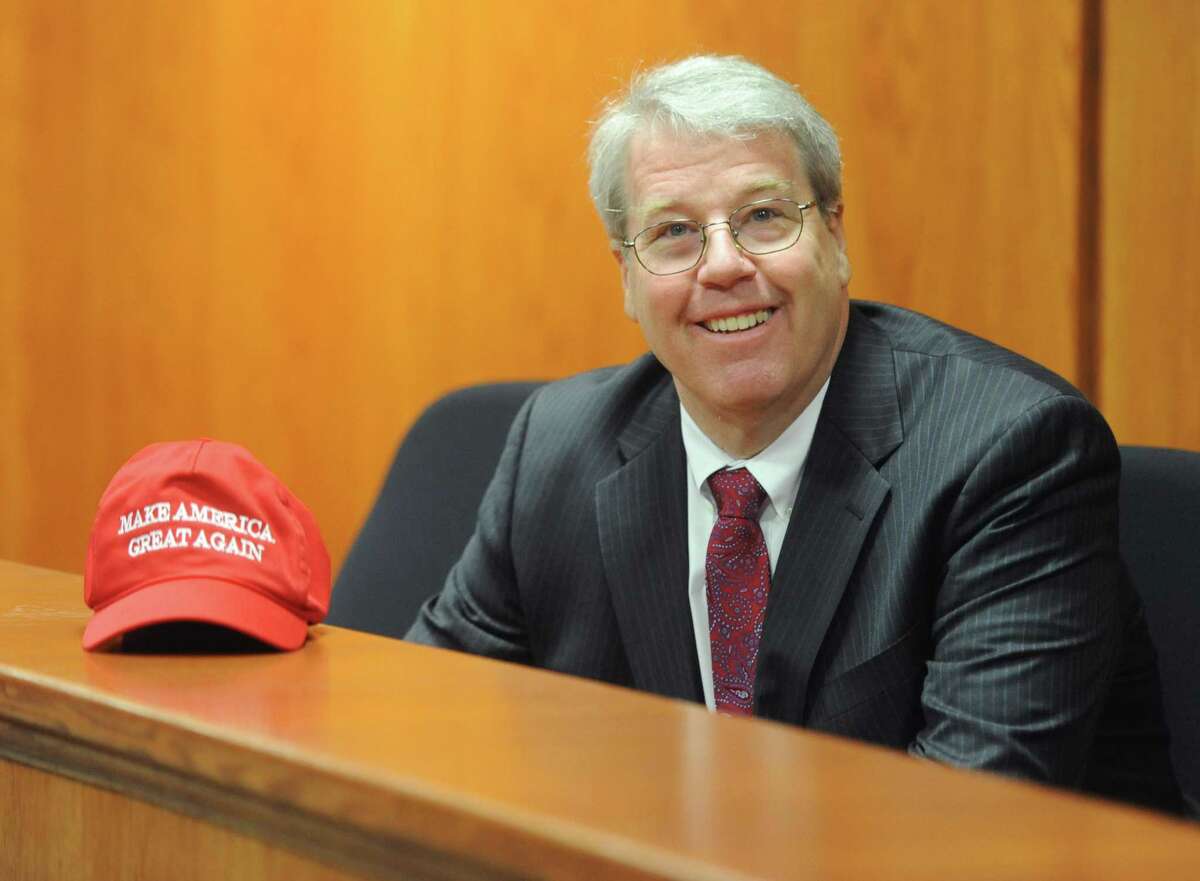 Greenwich Board of Estimate & Taxation President Michael Mason poses with his "Make America Great Again" hat at Town Hall in Greenwich, Conn. Thursday, Jan. 12, 2017.