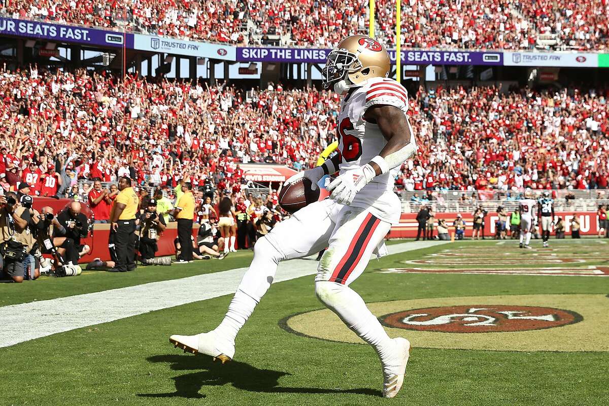 San Francisco 49ers running back Tevin Coleman (26) runs for four yards  against the Green Bay Packers in the second quarter of the NFC Championship  at Levi's Stadium in Santa Clara, California