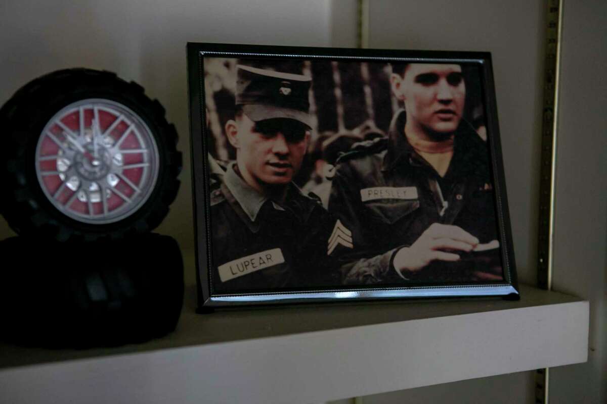 A framed photo of Larry Lupear and Elvis Presley sits on display in Lupear’s San Antonio home on Oct. 3, 2019. Lupear met Elvis Presley in the Army when they both trained at Fort Hood and later were stationed in Germany in the same outfit.