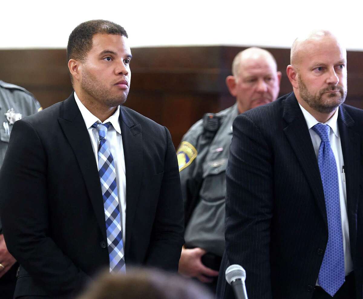 Hamden police Officer Devin Eaton, left, is arraigned in Superior Court in New Haven Oct. 28, 2019. At right is his attorney, Gregory Cerritelli.