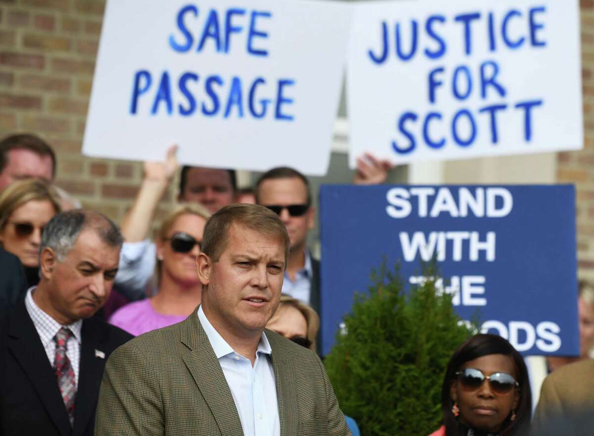 Darien man Scott Hapgood speaks at Town Hall in Darien, Conn. Monday, Oct. 28, 2019 as U.S. Sen. Richard Blumenthal, D-Conn., and the town show support for him in his manslaughter charge from a family vacation in Anguilla. Hapgood is facing a manslaughter charge regarding the death of a man who the family says attacked Hapgood in his hotel, forcing him to defend himself and his family. A revised autopsy report, based on new toxicology tests, determined the man died from a lethal dose of cocaine and not from injuries he sustained in the fight. U.S. Sen. Blumenthal, Darien First Selectman Jayme Stevenson, and friends and family are asking for a fair and transparent trial, as well as guaranteed safe passage, as Hapgood returns to Anguilla to face charges.