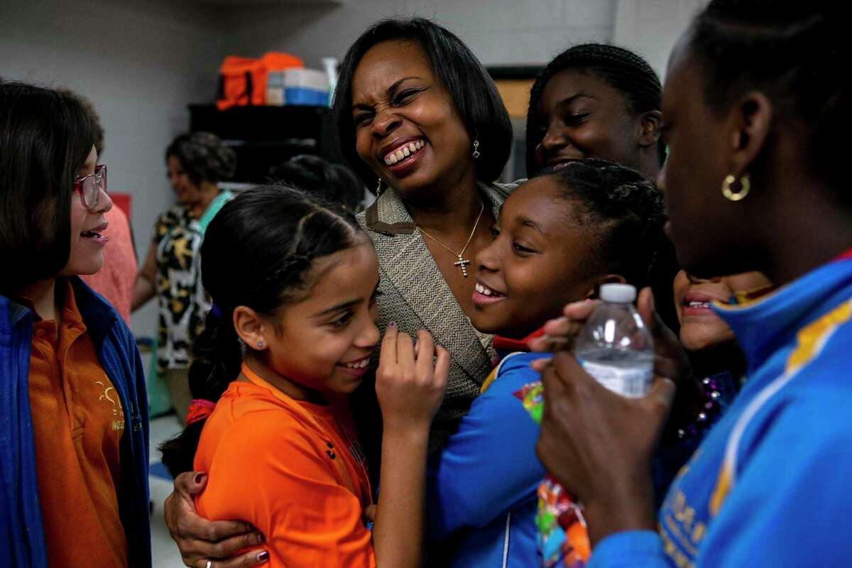 Former San Antonio Mayor Ivy Taylor is engulfed by young women after a community program in 2019. Taylor will make an excellent college president and we wish her the best in this next chapter.