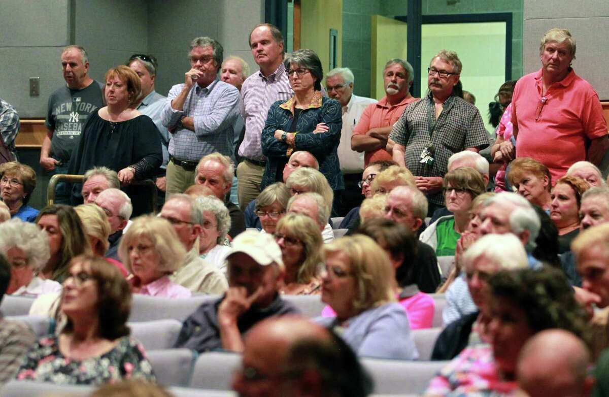 It was standing room only for residents attending Shelton Planning and Zoning Commission's public hearing on a proposed development at Shelton Intermediate School in Shelton, Conn., on Wednesday June 27, 2018. The proposed housing cluster on 6 acres has caused hundreds of residents to voice their opposition to the project.