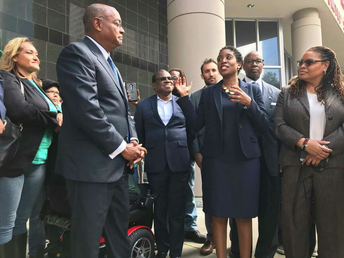 Harris County Court at Law Judge Genesis Draper addresses her concerns with the old bail system that had disparate outcomes for racial minorities as Commissioner Rodney Ellis, who actively backed the bail challenge, listens during a press debriefing outside the federal courthouse in Houston on Monday, Oct. 28, 2019.