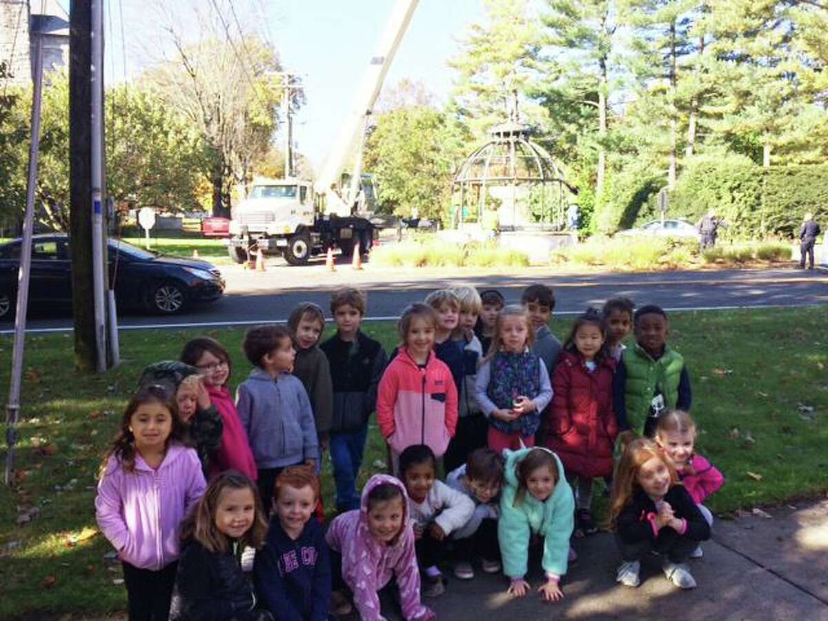 Creative Children’s Korner preschool students stand in front of the Cass Gilbert fountain last week. The Fountain is receiving its winter cover in the background.