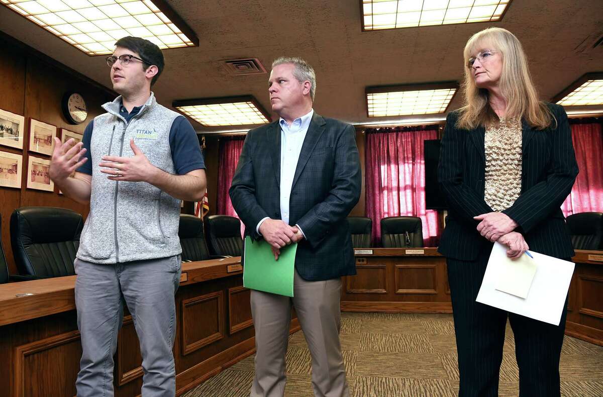 From left, Adam Teff, general manager of Titan Energy, Ken Carney, chairman of the West Haven High School building committee, and Mayor Nancy Rossi hold a press conference Monday at West Haven City Hall to talk about the solar panel project planned for the renovated high school.