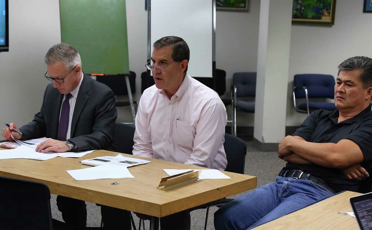 From left, Tom Hamilton, chief financial officer, Jim Giuliano, facility project manager and president of Construction Solutions Group, and Alan Lo, building and facilities manager, address questions from the Board of Education's Facilities Committee Monday night.