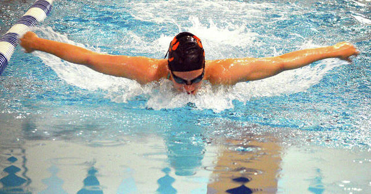 Edwardsville’s Josie Bushell swims the butterfly during practice at Chuck Fruit Aquatic Center.