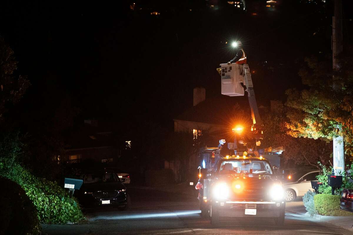 Kevin Stephens, a PG&E employee, restores the power on Sims Drive in Oakland, Calif. on Monday, Oct. 28, 2019.