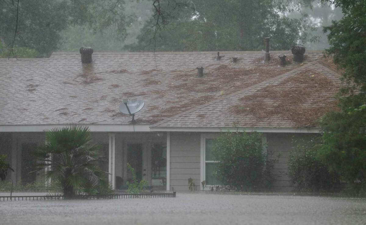 Homes in the Lochshire neighborhood were flooded after the Luce Bayou overflowed during Tropical Storm Imelda Friday, Sept. 20, 2019, in Huffman, Texas.