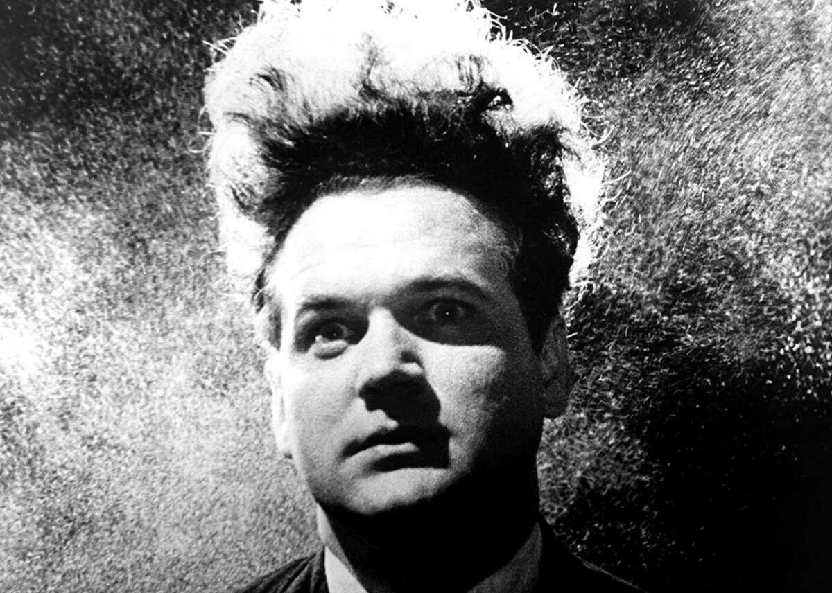Eraserhead (1977) Lynch’s first film was shot in black and white and at night over a five-year period, with a small production crew who worked in stables surrounding a mansion on the campus of the American Film Institute (where Lynch was a student). Lynch “laid claim” to the stables, empty structures he used for production and sets and where he lived for much of the filming, after receiving equipment and a small budget from the film school. “Eraserhead” features baffling visuals that are arresting and grotesque in this hyper-surreal, science-fiction tale that belies conventional storytelling in its presentation of Henry, whose partner has a baby—a deformed, bizarro, oozing creature. In his memoir “Room to Dream,” Lynch writes that his first plan for the ending was to have “Henry being devoured by the demonic baby.” The cult film is famously puzzling, and Lynch has claimed its most popular interpretations (fears around domesticity and fatherhood) have not aligned with how he sees the film. Instead, he offers it was inspired by the industrial, smokestack character of Philadelphia, or what he calls “the fringelands.” At the same time, he calls the strange work—which also features an addled creature called The Man in the Planet who pulls levers from afar—profoundly spiritual. This slideshow was first published on theStacker.com