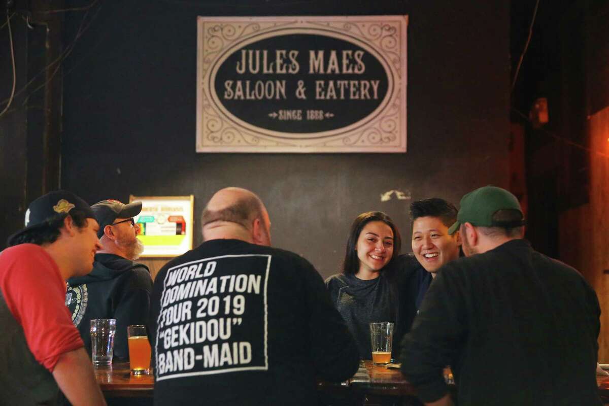 Patrons drink in the game room at Georgetown's Jules Maes Saloon & Eatery which first opened in 1888. Photographed Oct. 25, 2019.