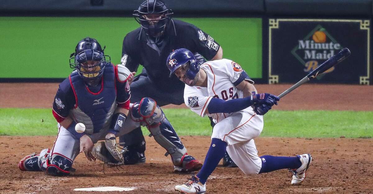 Houston Astros second baseman Jose Altuve (27) strikes out to end the fifth inning and strand two base runners during Game 6 of the World Series at Minute Maid Park on Tuesday, Oct. 29, 2019, in Houston.