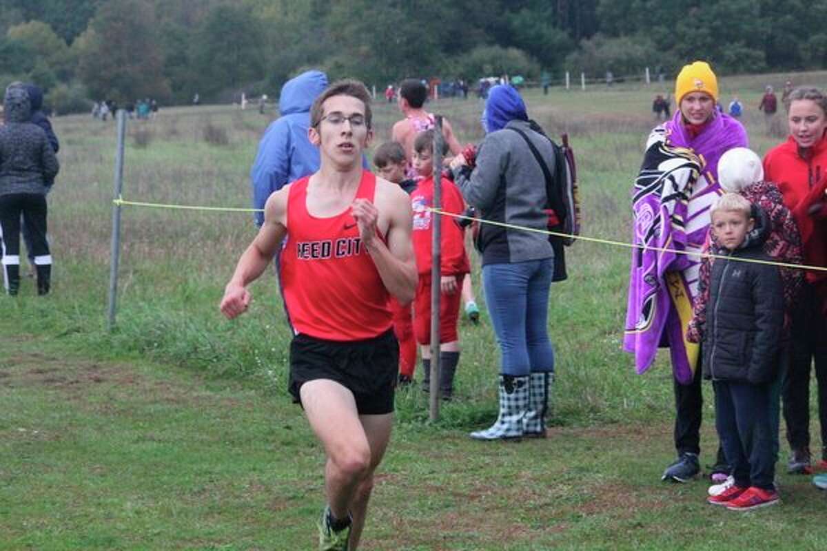 Reed City's Jared Karns finishes his race at Chippewa Hills recently. (Herald Review photo/John Raffel)