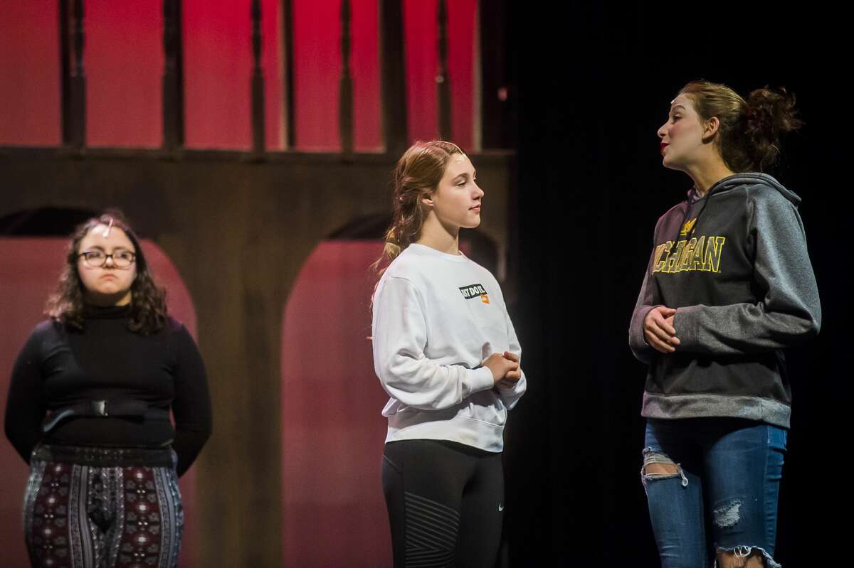 From left, Lilly Kyro in the role of Tilney, Amelia Sutherland in the role of Queen Elizabeth, and Alexandria Bressette in the role of Viola de Lesseps act out a scene during a rehearsal for Midland High School's production of "Shakespeare in Love" Monday, Oct. 28, 2019 at Central Auditorium. (Katy Kildee/kkildee@mdn.net)