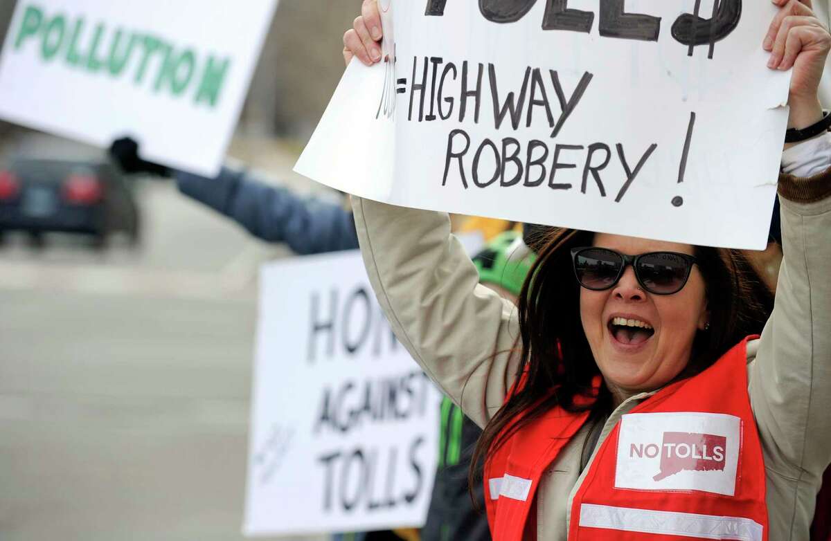 Donna cody of Woodbury joins with approximately 100 activists from a anti-toll group No Tolls CT, as they stage a protest in front of the Government Center on Saturday, Feb. 23, 2019 in Stamford, Connecticut.