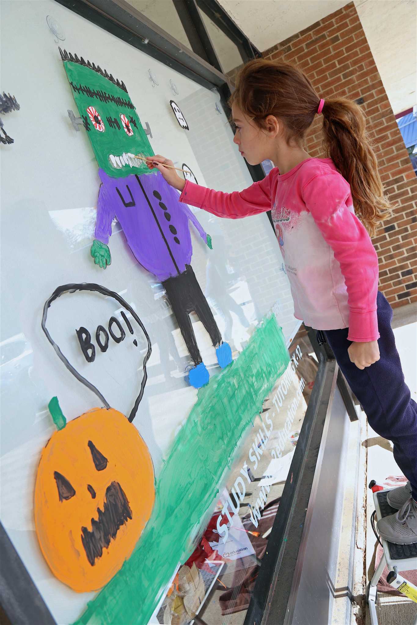 In Pictures Halloween window decorating in Westport