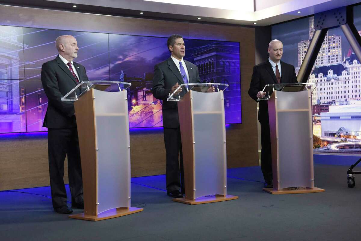 Troy Mayor Patrick Madden, left, former Democratic Troy City Council President Rodney Wiltshire, center, and Tom Reale take part in the Troy Mayoral Debate at Spectrum News Albany on Wednesday, Oct. 30, 2019, in Albany, N.Y. (Paul Buckowski/Times Union)