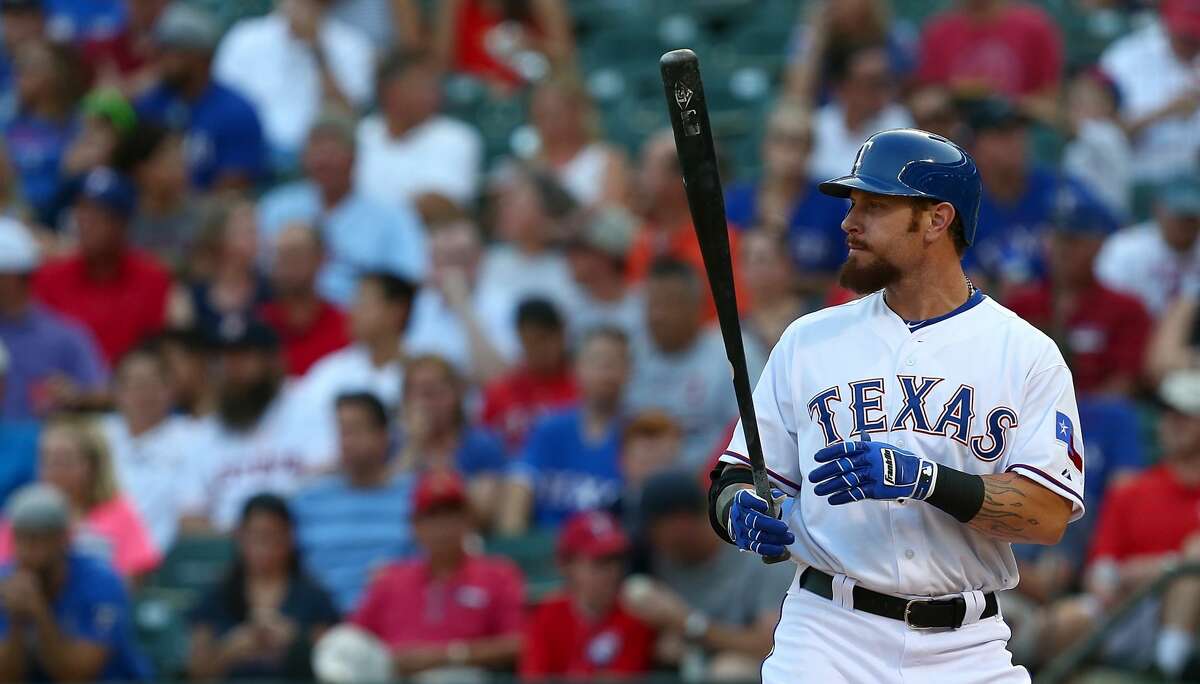 ARLINGTON, TX - AUGUST 03: Josh Hamilton #32 of the Texas Rangers wears Franklin batting gloves as he bats during a game against the Houston Astros at Globe Life Park in Arlington on August 3, 2015 in Arlington, Texas. The Texas Rangers defeated the Houston Astros 12-9. (Photo by Sarah Crabill/Getty Images)